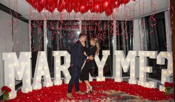 "Marry Me" Proposal Setup - Marquee Letters and Balloon Ceiling - Toronto Proposal Company